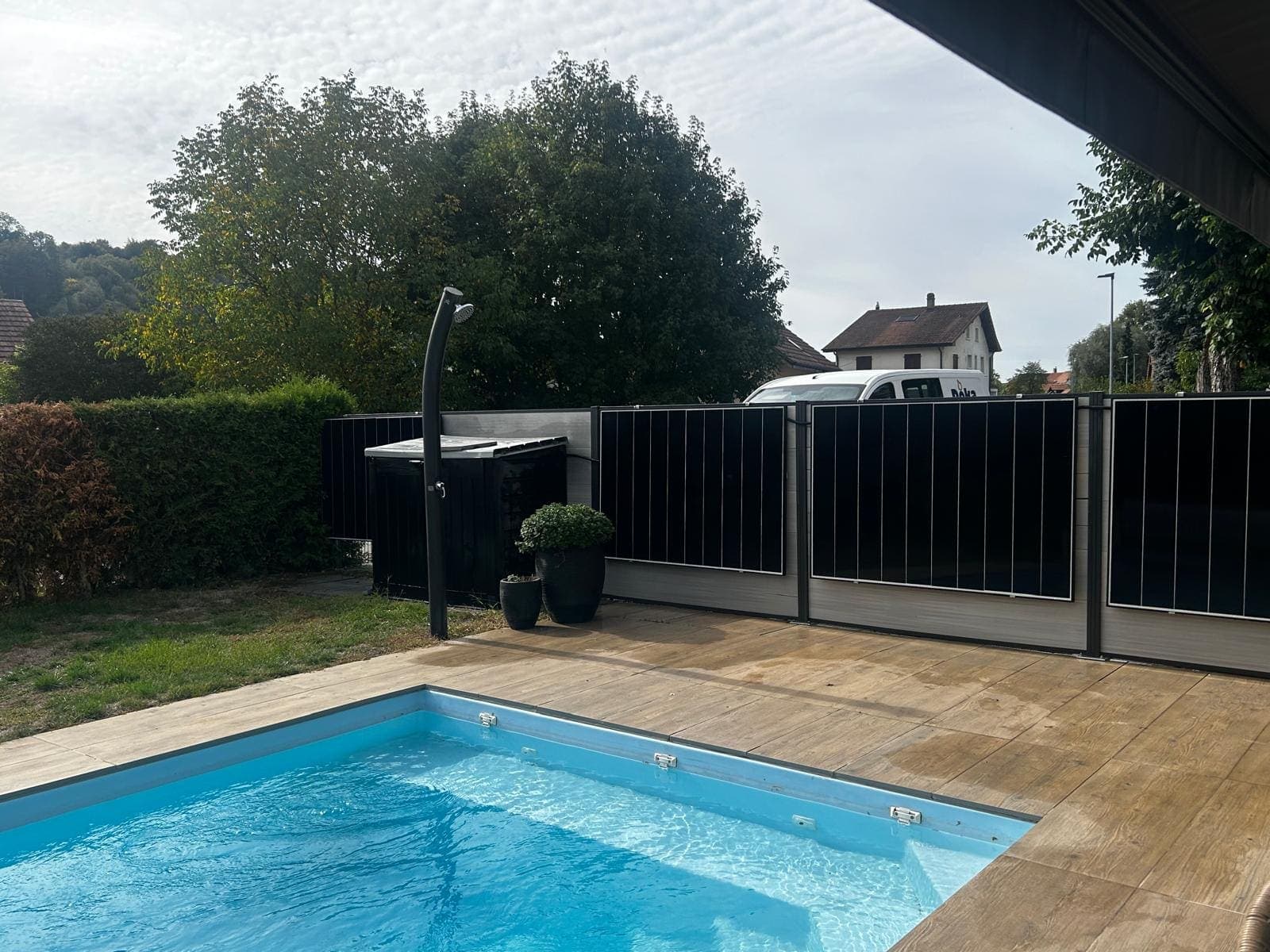 Pool terrace with solar fence and outdoor shower